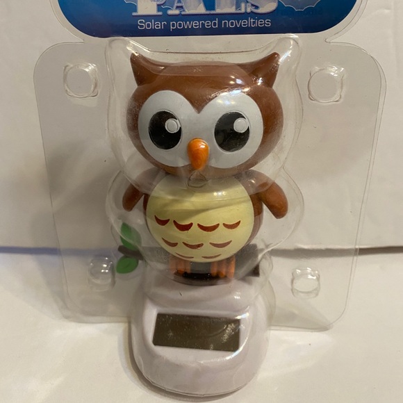 Solar powered dancing brown owl figuire